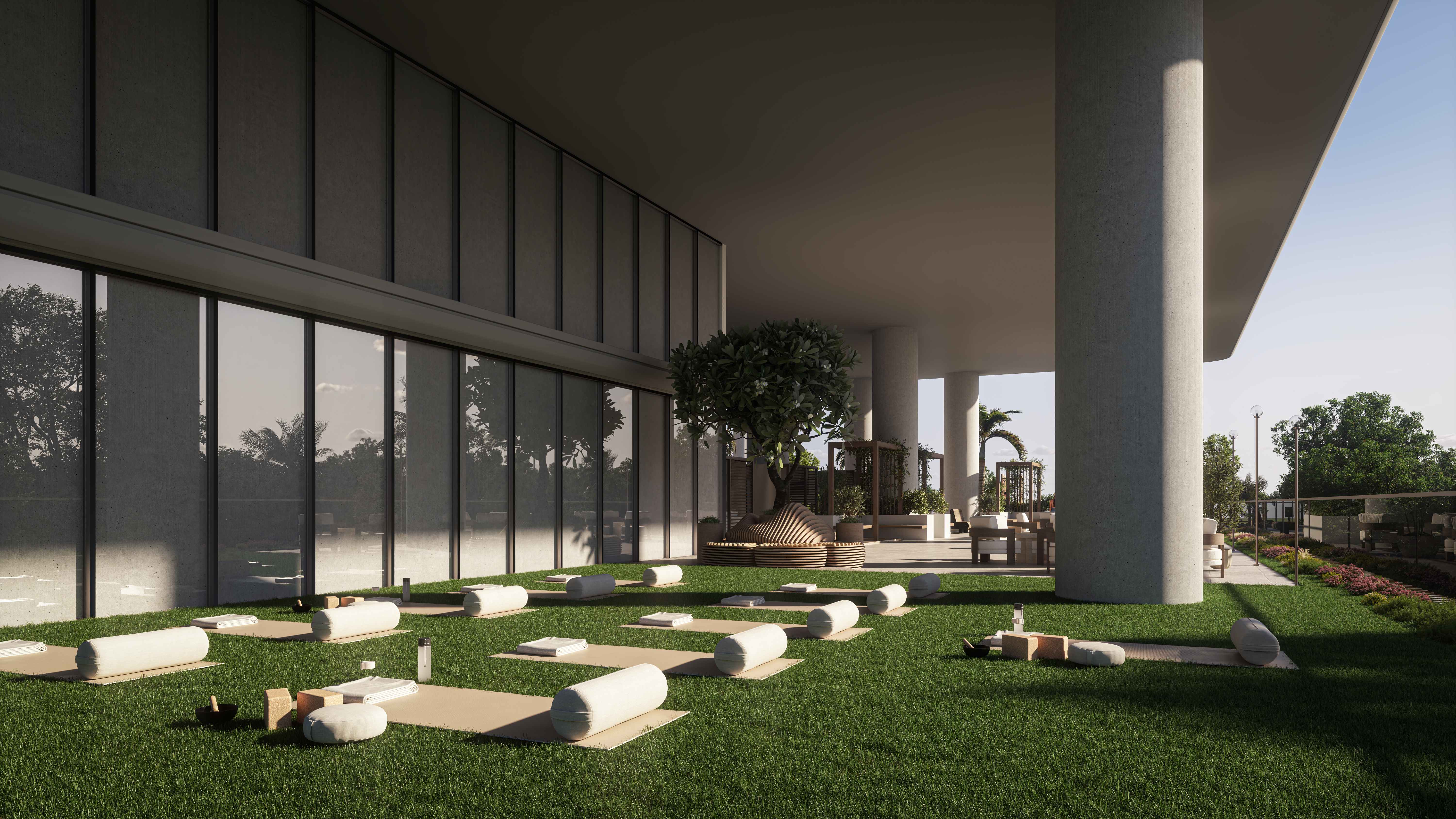 Outdoor yoga and wellness area with mats on grass