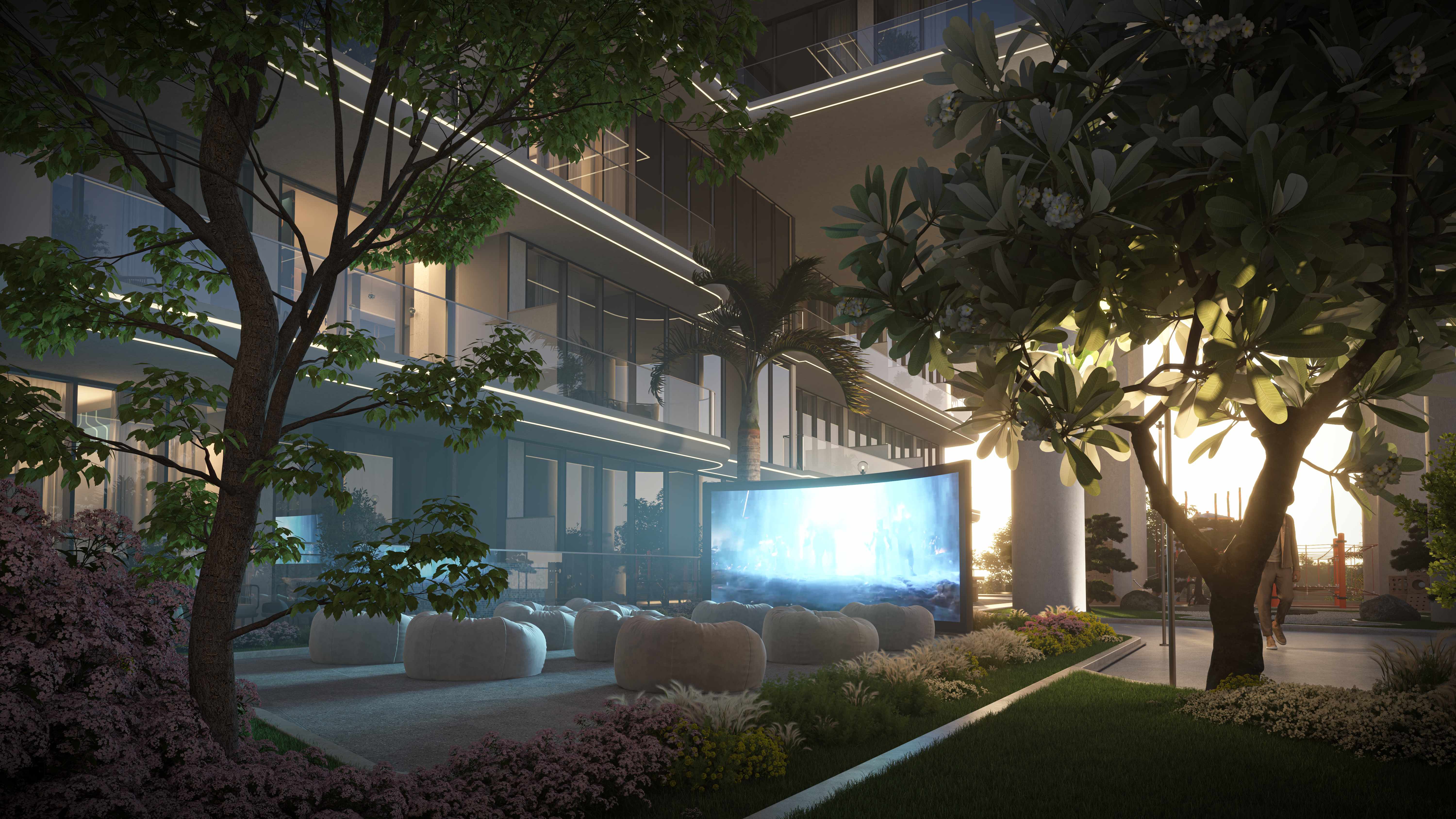 Outdoor cinema area with large screen and seating